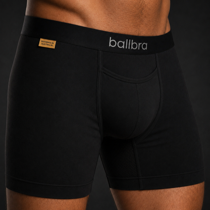 Close-up of black Ballbra boxer briefs on a model, showing the support pouch fit and modal fabric texture